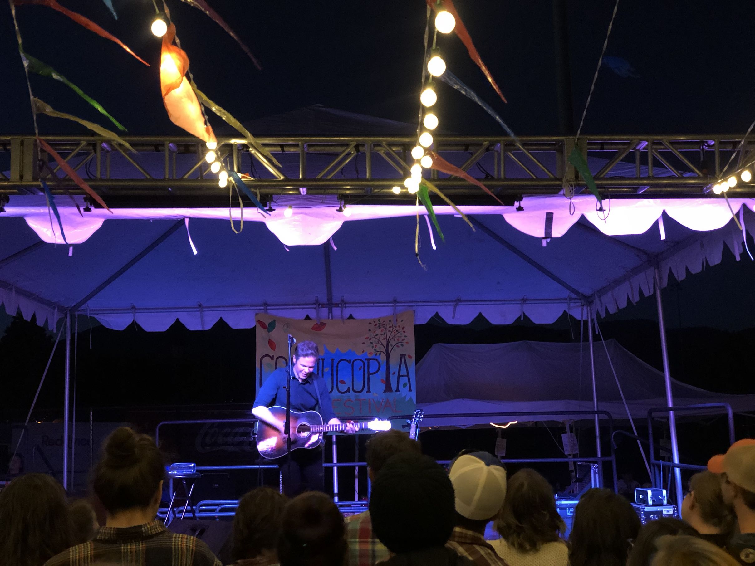Josh Ritter performing on stage at Flagstaff Cornucopia. 