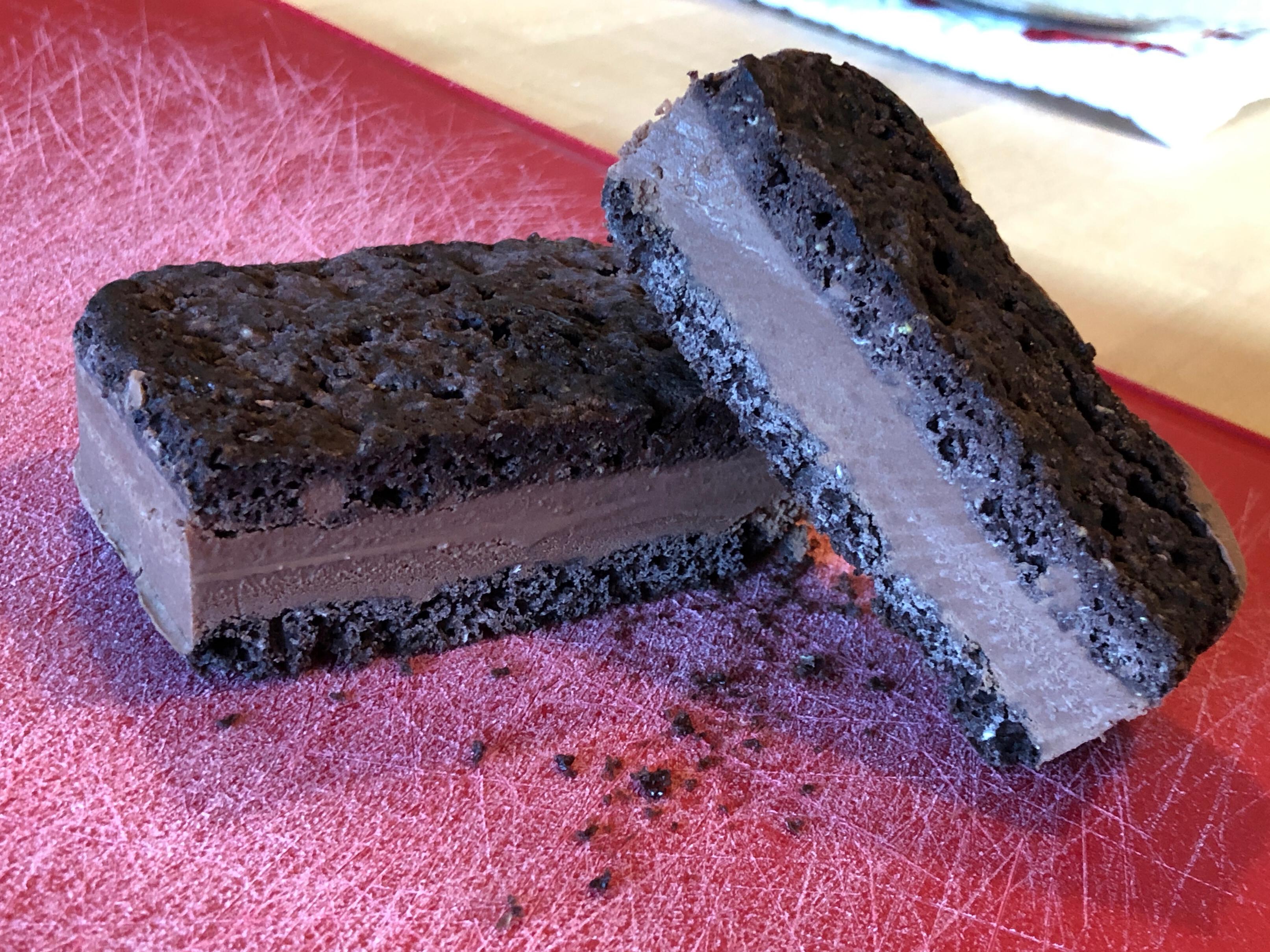 Photo of a chocolate ice cream sandwich on a cutting board 