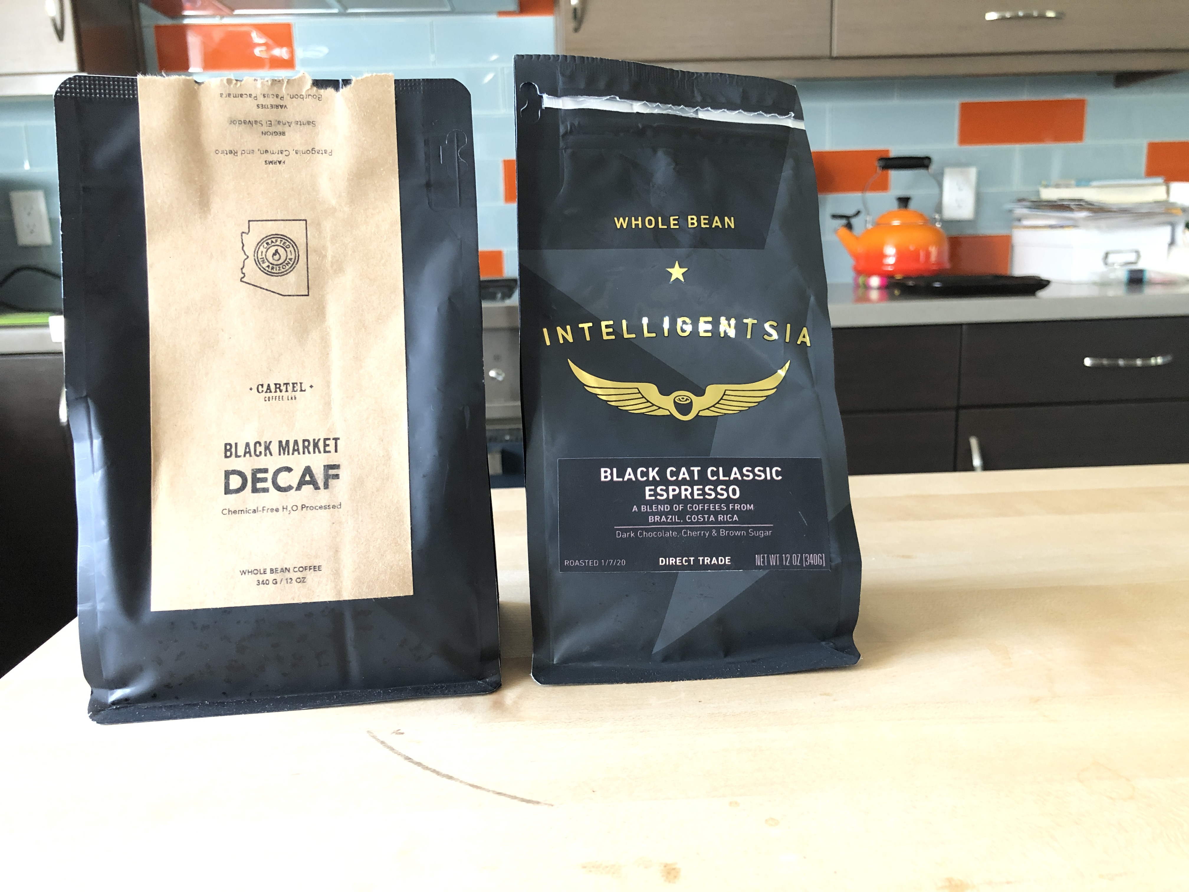 A bag of Cartel decaf and Intelligentsia espresso side by side 
